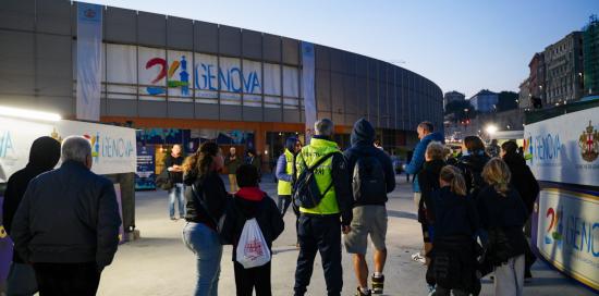 Una foto dell'esterno del Palasport con in bella vista il logo di Genova 2024