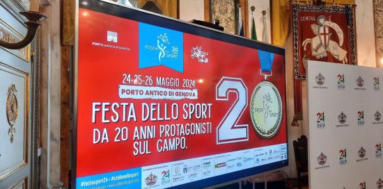 La locandina della Festa dello Sport trasmessa sul monitor del Salone di Rappresentanza di Palazzo Tursi