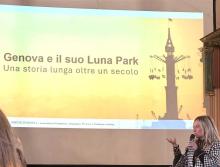 Un momento dell'intervento dell'assessore Bordilli, sullo sfondo la slide "Genova e il suo luna park"