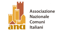 Il logo di Anci: torri di colore ocra e marrone, di varie dimensioni, sovrapposte e stilizzate