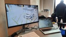Foto schermo pc con immagini di robot IIT per catalogazione volumi nelle biblioteche