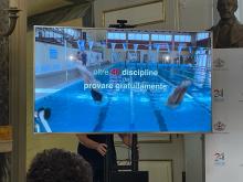 slide con scritta oltre 40 diswcipline da provare gratuitamente, sullo sfondo l'acqua di una piscina
