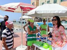 operatori con cappellini verdi